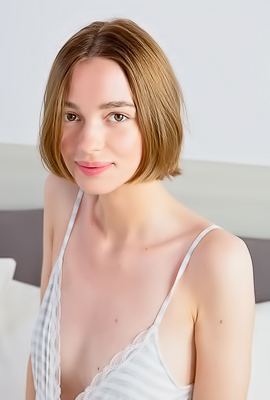 Amy Moloko Spreading Her Slender Thighs For An Intimate View Of Her Shaved Pussy